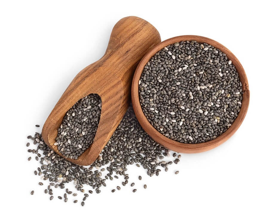 Chia seeds in wooden bowl isolated on white background
